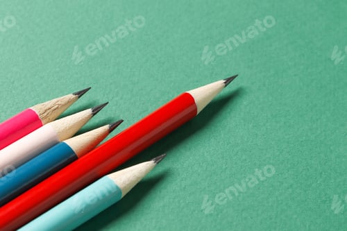 Preview: Color Pencils On A Green Background. Place For Text