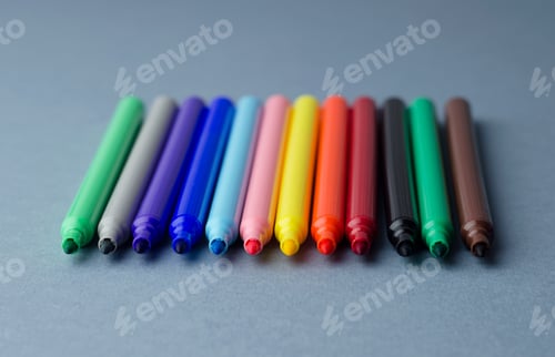 Preview: Multiple Colorful Magic Markers Over Blue Background, Shallow Depth Of Field