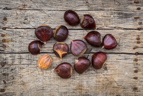 Preview: Fresh Raw Chestnuts On A Wooden Background