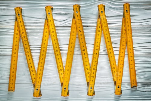 Preview: Yellow Wooden Meter On White Board