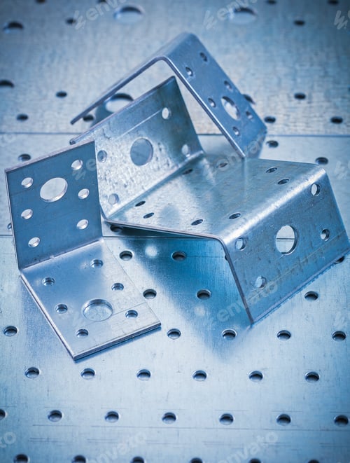 Preview: Stainless Drilled Angle Fasteners On Perforated Metallic Sheet Construction Concept.