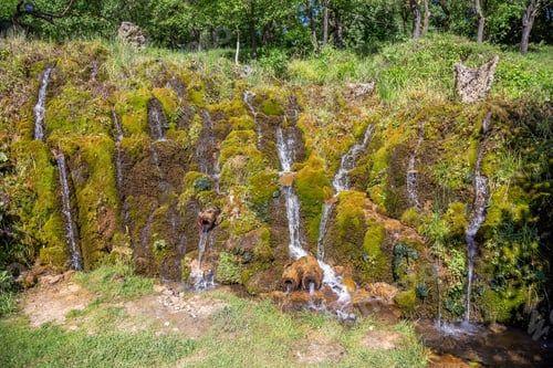 Preview: Handmade Outdoor Waterfall With Many Streams And Vegetation Among The Rocks, Located In Lisine