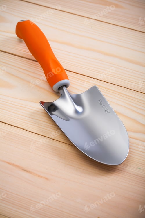 Preview: Gardening Hand Tools - Spade With Orange Handle On Wooden Boards
