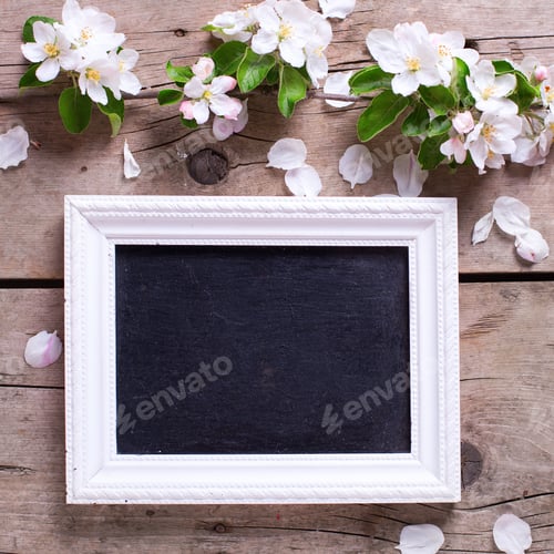 Preview: Empty Blackboard And Tender Apple Tree Flowers On Aged Vintage Wooden Background. Selective Focus