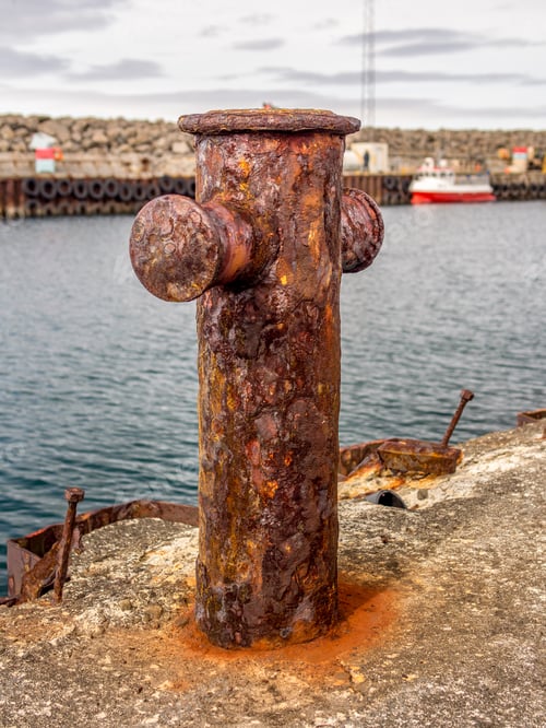 Preview: Rusty Mooring Bollard Exposed To The Tough Sea Of Iceland
