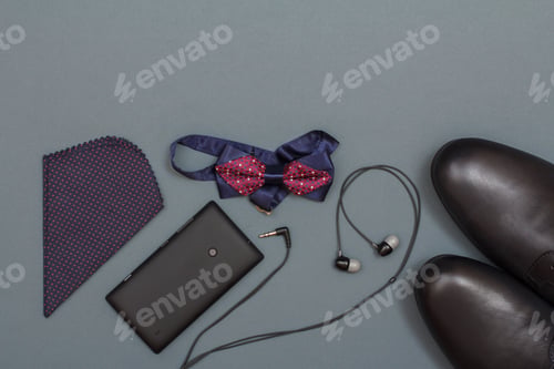 Preview: Handkerchief, Mobile Phone, Headphones, Bow Tie And Black Men'S Shoes On Grey Background