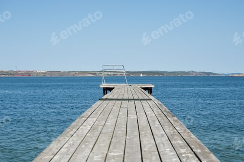 Preview: Wooden Pier With A Spring Board Waiting For The Summer To Arrive.