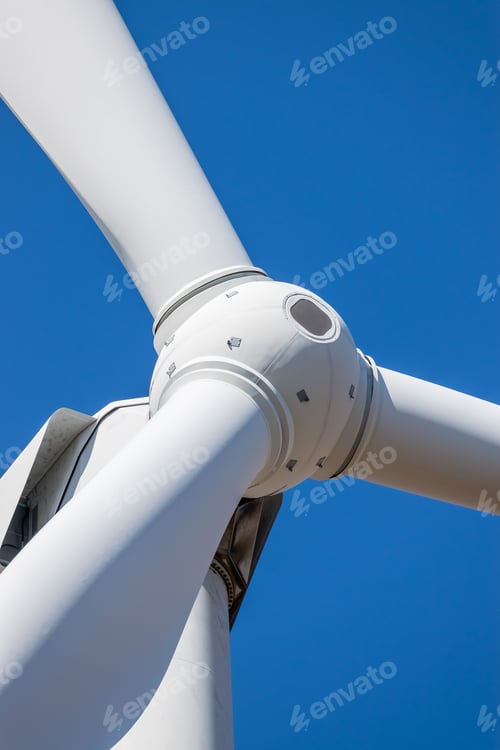 Preview: Wind Turbine Head Rotor Closeup Against Blue Sky Background