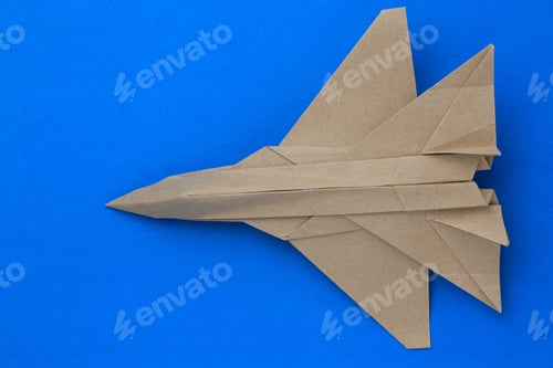 Preview: Origami Paper Airplane Mockup. Selective Focus. Blue Background