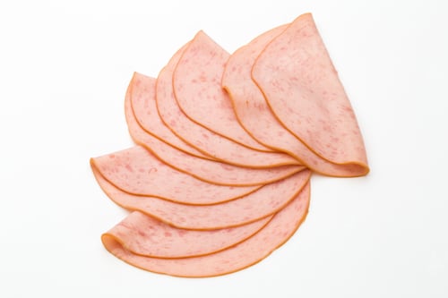 Preview: Sliced Boiled Ham Sausage Isolated On White Background.