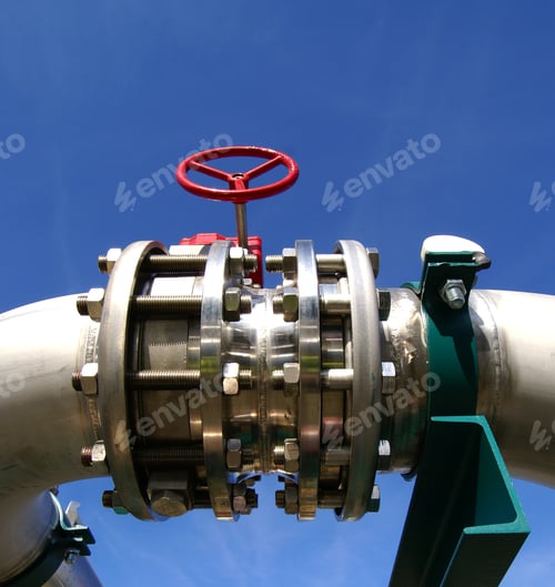 Preview: Industrial Zone, Steel Pipelines And Valves Against Blue Sky