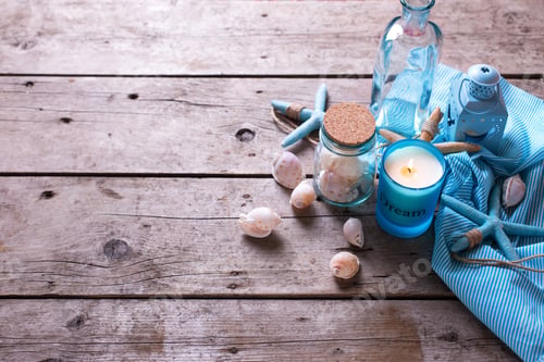 Preview: Ocean Theme Background. Blue Candle And Marine Items On Aged Wooden Background. Sea Objects On