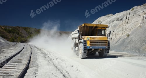 Preview: Mining Dump Truck Rushes At High Speed Along A Dusty Road In A Stone Quarry, Close-Up, Panorama.