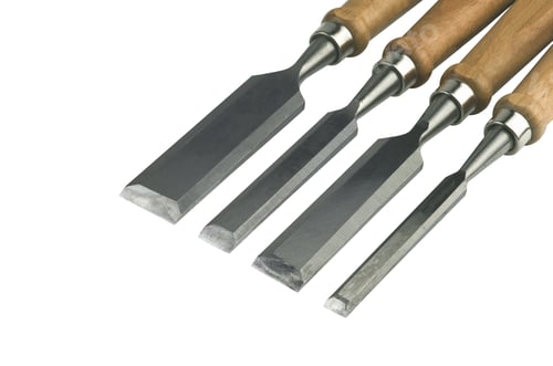 Preview: Four Chisels Of Various Widths Lying On A White Background