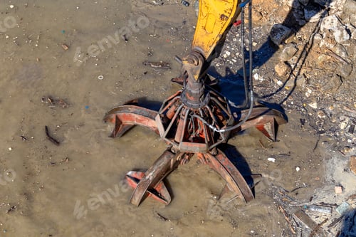 Preview: Hydraulic Multi Valve Crab Bucket Cleanin Riverbed Of A River From The Mud And Debris.