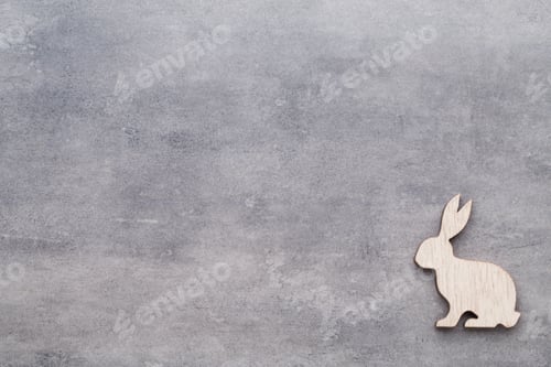 Preview: Handmade Wood Easter Rabbits On Wooden Background.
