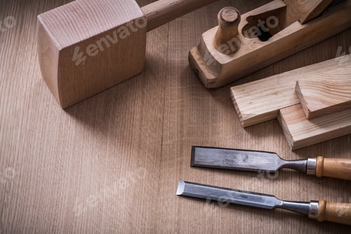 Preview: Hand Mallet Planer Metal Chisels And Wooden Stud On Wood Board Construction Concept.