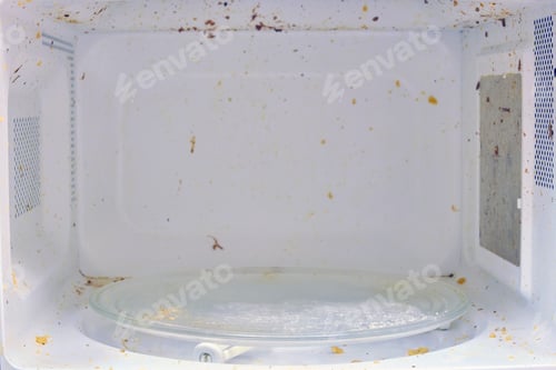 Preview: Dirty Microwave Interior with Food Splatter Close-up