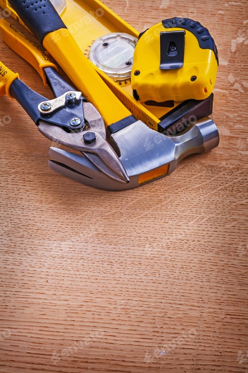 Preview: Hammer Construction Level Nippers And Tape Measure On Wooden Background Maintenance Concept