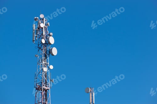 Preview: Gsm Tower With A Series Of Aerials On It Against Blue Sky On The Background