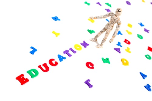 Preview: Manikin Standing At End Of Letters Spelling Education