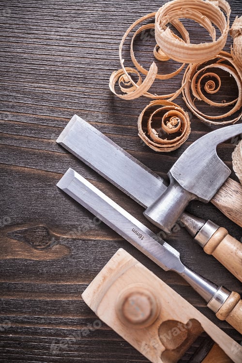 Preview: Planer Claw Hammer Flat Chisels And Wooden Curled Shavings On Vintage Wood Board Construction