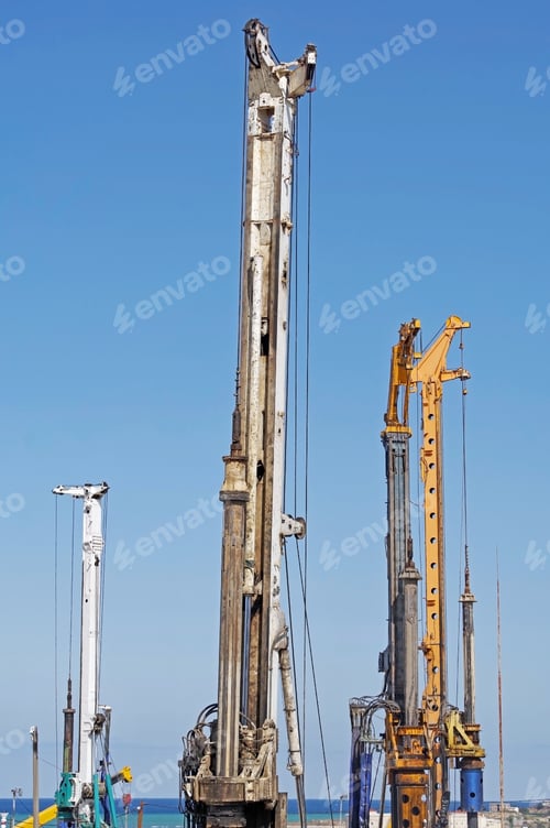 Preview: The Pile Driving Machines On A Background Blue Sky