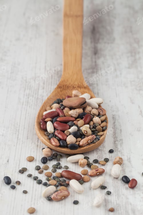 Preview: Assortment Of Various Raw Mixed Legumes With A Wooden Spoon