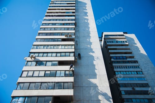 Preview: Climbers Carry Out Construction And Installation Work On The Facade Of The Building