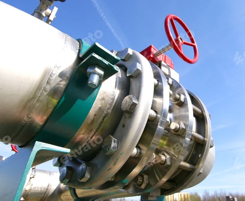 Preview: Industrial Zone, Steel Pipelines And Valves Against Blue Sky
