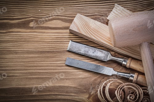 Preview: Wooden Hammer Stud Firmer Chisels Planning Chips On Vintage Wood Board.