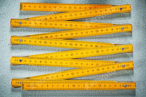 Preview: Wooden Meter On Concrete Surface Construction Concept.