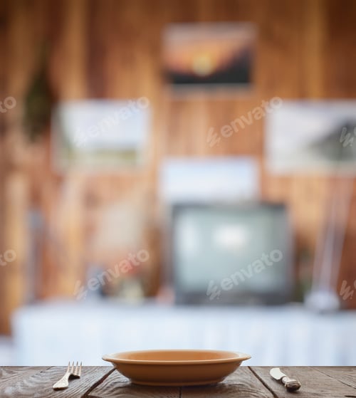 Preview: Empty Plate With Fork And Knife On Wooden Table In The Living Room