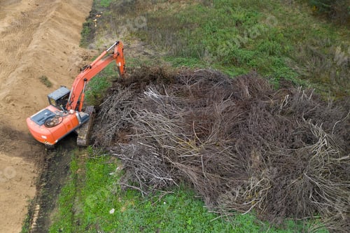 Preview: Excavator Working In A Swamp Top View From A Drone