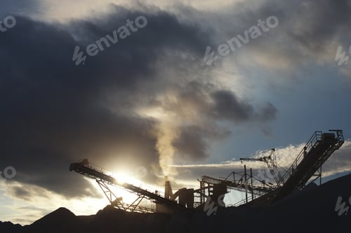 Preview: Silhouette Of A Crusher Plant On The Background Of Clouds At Sunset. Mining Industry.