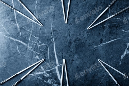 Preview: Wooden Chopsticks Over Dark Texture Background. Top View, Flat Lay. Color Of The Year 2020 Classic