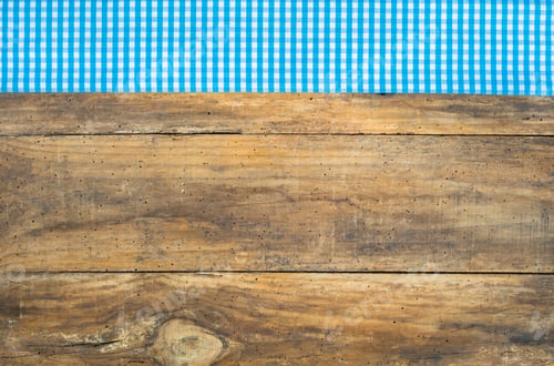 Preview: Wooden Background With Blue Checkered Fabric Border.