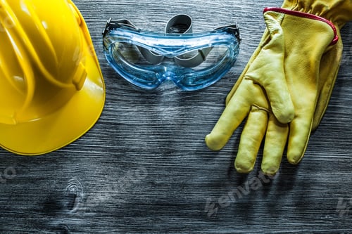 Preview: Safety Cap Gloves Goggles On Vintage Wooden Board.