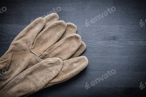 Preview: Two Protective Gloves On Dark Wood Board.