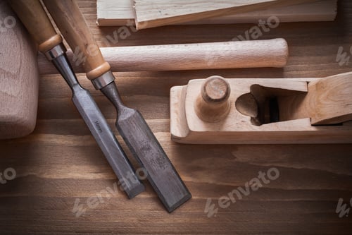 Preview: Wooden Hammer Planner Chisels Building Planks On Wood Board Construction Concept.