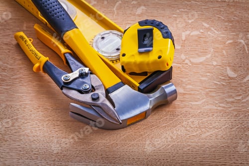 Preview: Cutting Pliers Claw Hammer Construction Level And Tape Measure On Wooden Background