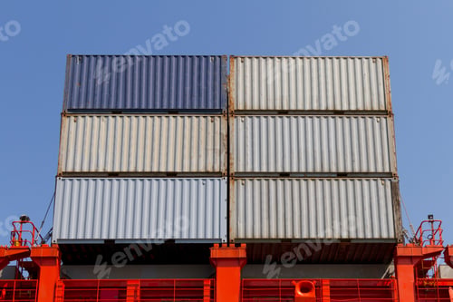 Stacked Shipping Containers with Bold Colors on a Ship
