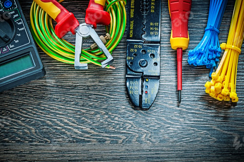 Preview: Electric Tester Screwdriver Rolled Cable Ties Insulation Strippers On Wood Board.