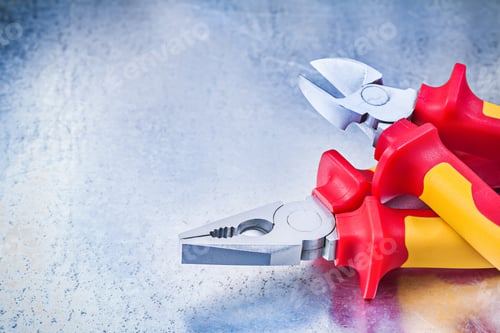 Preview: Set Of Nippers Pliers On Scratched Metallic Background Construction Concept.