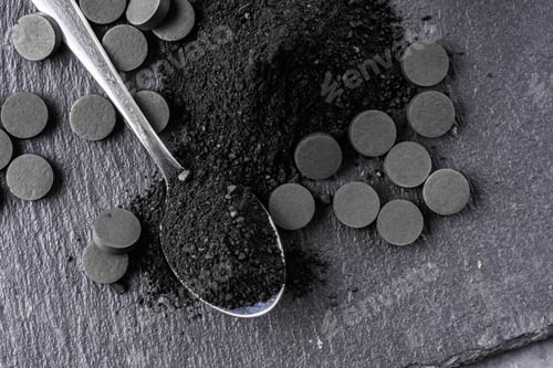 Preview: Activated Carbon On A Dark Stone Background