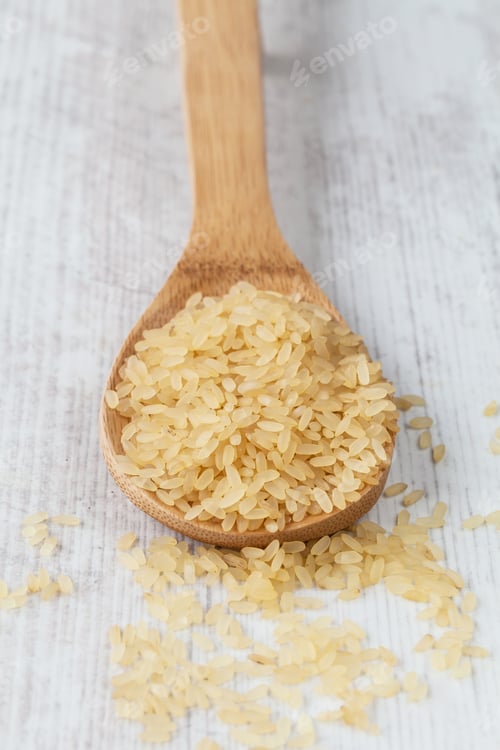 Preview: Bunch Of Yellow Rice On A Wooden Spoon