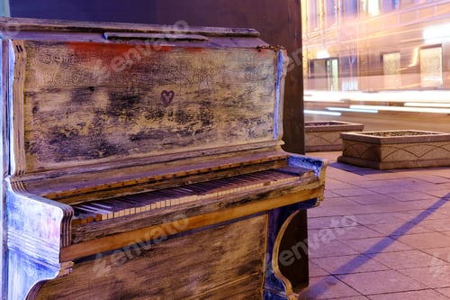 Preview: An Old White Piano Stands On A Night Street Near The Road