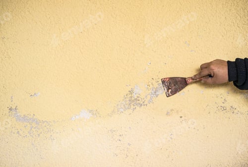 Preview: Wall Fill, Plasterer With Scraper In The Hand Is Repairing Home.