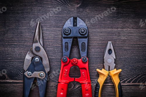 Preview: Pliers Steel Cutter Tin Snips On Wooden Board Construction Concept.