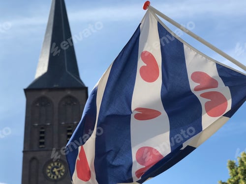 Preview: The Frisian Flag With The Sint Werenfriduskerk A Church In Workum, Friesland, The Netherlands